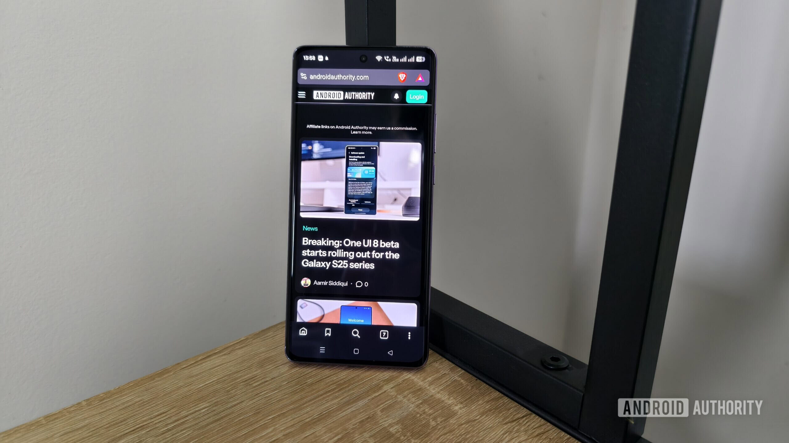 a smartphone showing the android authority site in dark mode a smartphone showing the android authority site in dark mode