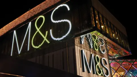 Getty Images An M&S storefront at night