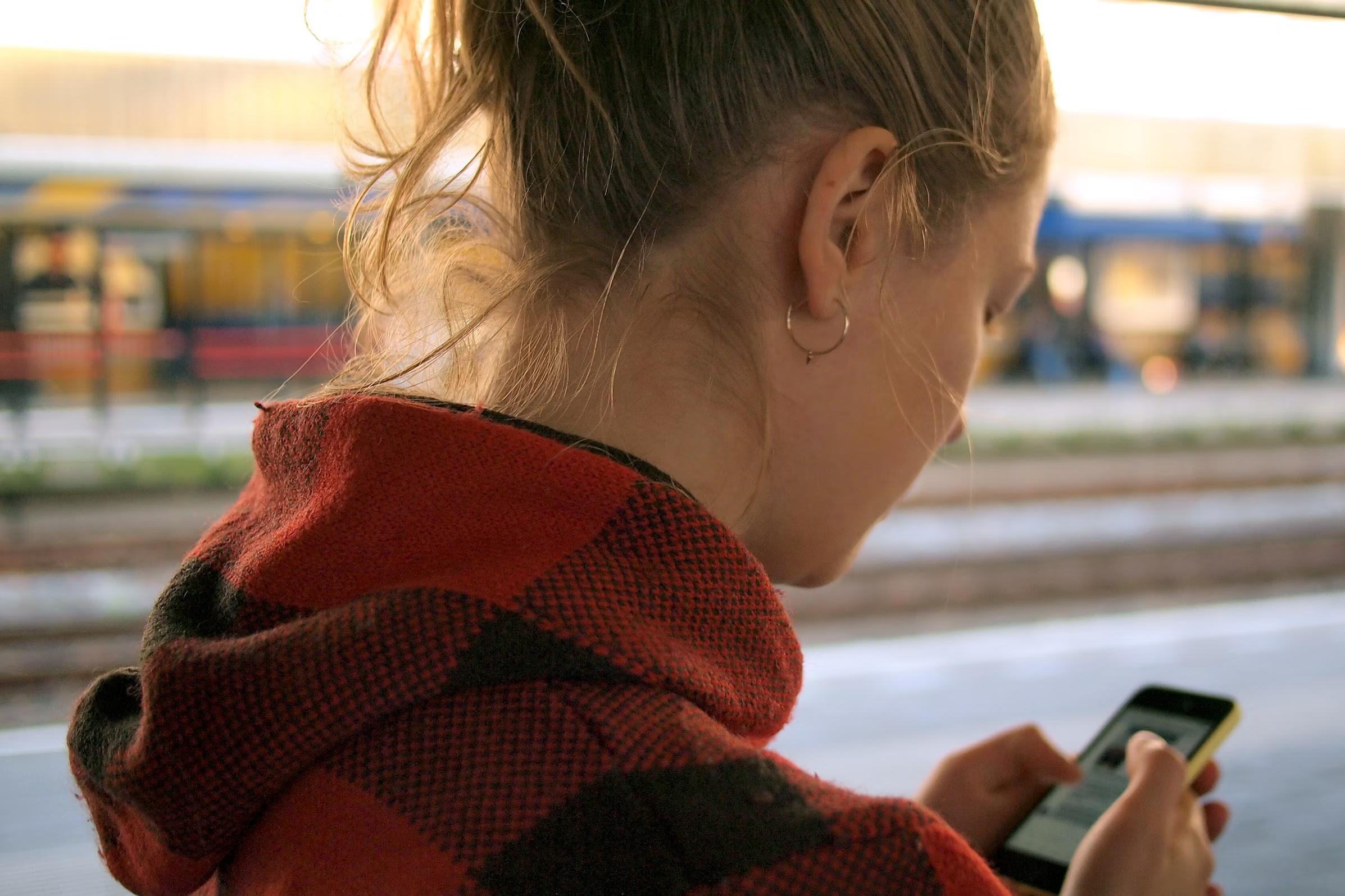 child smartphone tablet children Image credit Unsplash 002 A young user looks at a smartphone. Children, youth, social media.